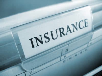 Contractor reviewing a certificate of insurance and construction contract